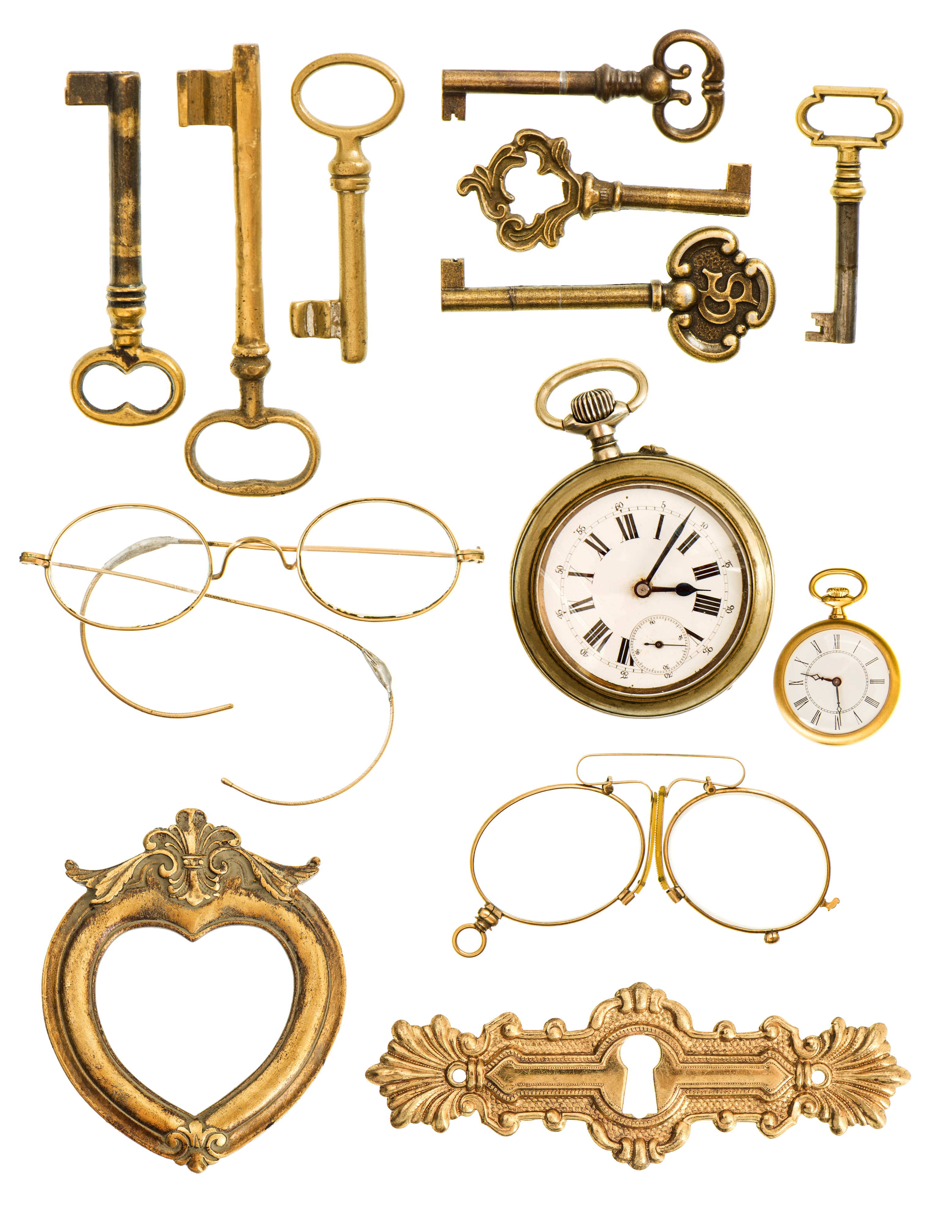 collection of golden vintage accessories. antique keys, clock, frame, glasses isolated on white background